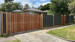 Colorbond fence with exposed posts and vertical merbau cladded gates [upl. by Godewyn72]