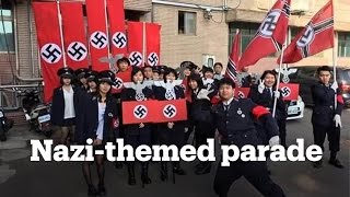 High school in Taiwan puts on Nazithemed Christmas parade [upl. by Idurt736]