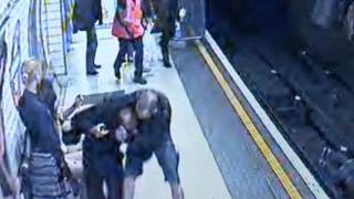 CCTV Man pushed stranger on to track at Leicester Square station London Tube [upl. by Shellie]