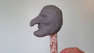 Molding the Mr Punch head from oil based clay before applying paper mache [upl. by Bardo]