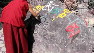 LamaZopaRinpoche painting mantras on a rock [upl. by Darmit261]