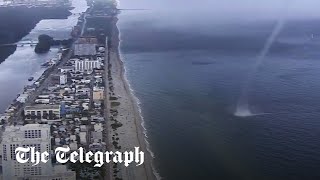 Waterspout crashes on to beach full of people in Miami Florida [upl. by Laure]