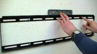 How to Mount a Large LCD LED or Plasma TV on a Wall using a Fixed TV Bracket [upl. by Aniretake]