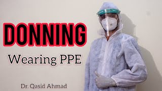 Part 1 Donning  Wearing PPE  How to properly wear PPE  COVID19 [upl. by Ahsaekal864]