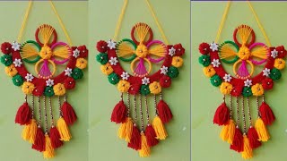 diwali decoretion ideas for woolen and old bangles flower wall hanging craft ideasDIY wall decor।। [upl. by Silera534]