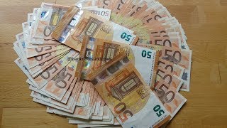 Counting a stack of 50 Euro banknotes [upl. by Brandtr515]