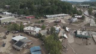 Drone footage shows muddy Asheville digging out from flooding and debris [upl. by Esnofla]