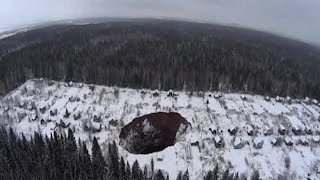 Sinkhole opens up in Russia [upl. by Eneroc36]