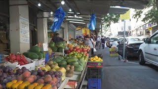 תושבי הצפון והסוחרים בשווקים מציינים חג תחת ירי טילים בלתי פוסק [upl. by Notyad]