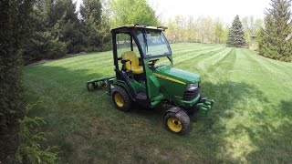 John Deere X748  Core Aerating the Lawn  20150510 [upl. by Azaria964]